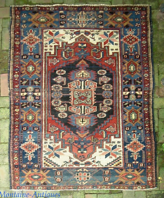 Bahktiari 4 ft 1 in x 5 ft 8 in. Beautiful old thing with knockout colors.  $20 UPS to Lower 48.  Check out recent finds @ http://www.montaine-antiques.com/oriental-rugs/    