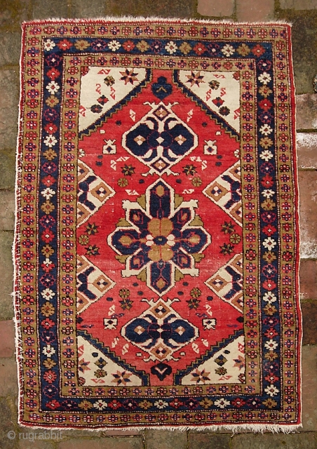 Turkish Pushti-- 2 ft 3 inches x 3 ft  4 inches. Interesting medallion design w/ Persian or Caucasian influence. Some inept old work securing one side cord which could easily be  ...