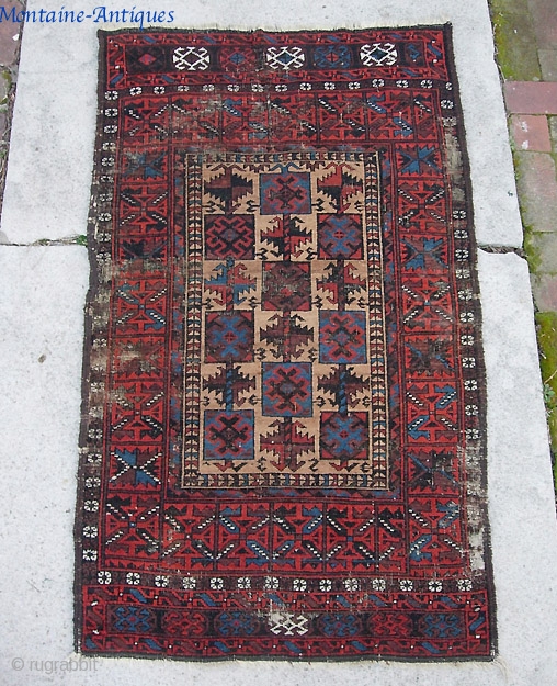 Belouchi-- 3 ft 0 by 5 ft 0 inches. An old and timeworn rug. Pretty unusual and interesting design.              