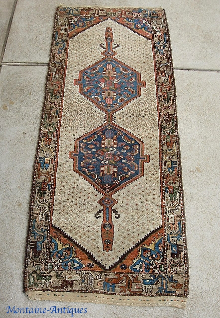 Hamadan-- 3 ft 2 inches by 8 ft. 2 inches, circa early 1900s. Nice little size. Very decorative double medallion with soft earth tones like a Serab. Pretty decent condition. Even pile  ...