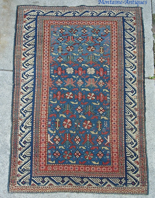 19th cent Kuba. 3 ft 5 x 5 ft 5 in. With this archaic border this one might be bloody ancient... possibly toward mid 19th cent? earlier?? Above my pay grade. Its  ...