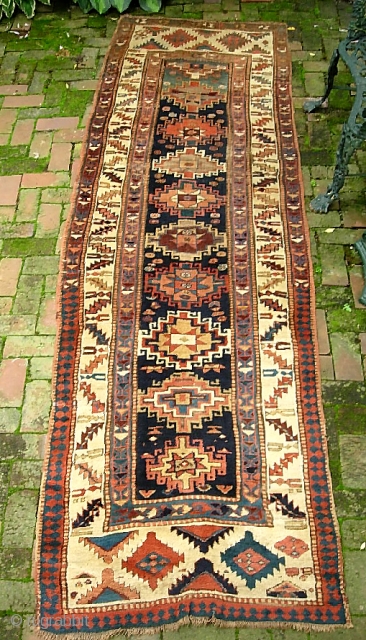 Ancient Caucasian. 3 ft 3 in x 10 ft 11 in. Moghan? Kazak?  Great archaic motifs. Interesting design change on the end borders. Wool is plush and grainy in texture. I  ...