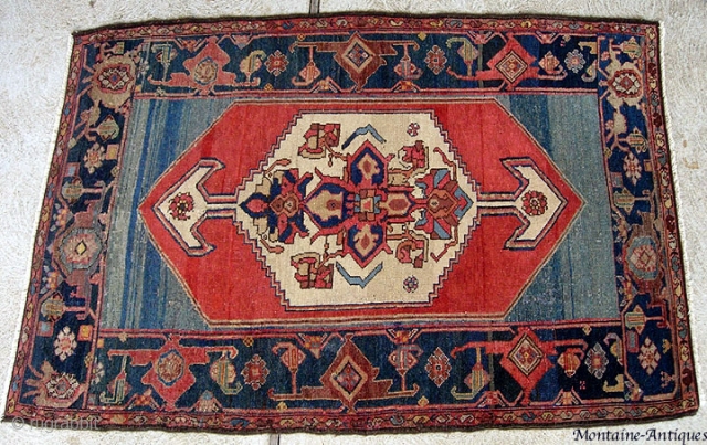  Kurdish? circa 1800s. 3’ 6” x 5’4”  A naive tribal interpretation of classic Persian Medallion and turtle border.  A real decorative piece with very saturated colors and  high  ...