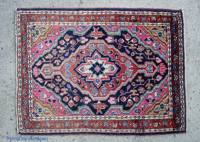 Sarouk pushti. 22 x 30 inches. Bright, bold, very decorative. i dont know where you can find these little Sarouks cheap. Seems like you have to either ante up... or you aint  ...