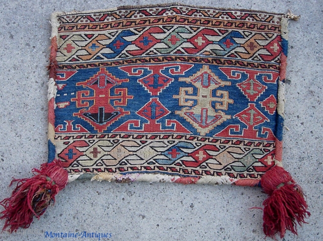 Bag Face with giant dingle-berries. 20 x 15 inches. Aside from being tribal Persian I have no idea who made this.            