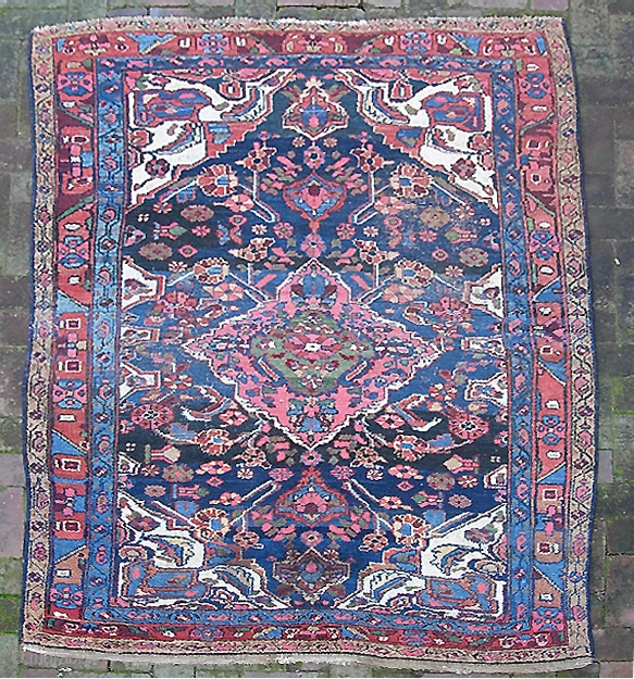 Kurdish. 4 ft 5 inches by 6 ft 5 inches.  Possibly from the Bidjar  area. Bold medallion design; terrific vegetable colors with lots of interesting abrashes. Original braided end weaves  ...