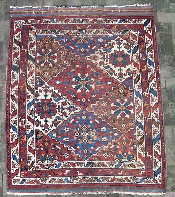 Afshar. 4 ft 0 inches by 5 ft 5 inches. Circa 1900 or earlier. Nomadic tribal piece has wide kelims at both ends. Interesting-- center warps are candy cane wool; peripheral warps  ...