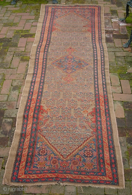 Camel Hamadan. 3 ft 2 inches by 10 ft 1 inches. Real old one-- possibly 19th century. Wool foundation. There are two old square reweaves. Even low pile and a couple small  ...