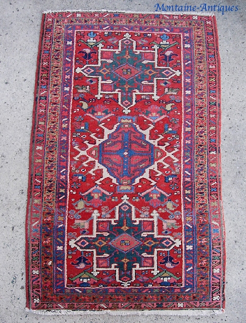Rug-- 2 ft 5 inches by 4 foot 1 inches. Looks like a garden variety Karaja. But guess what? It is really a Heriz and a pretty nice tight weave to boot. 