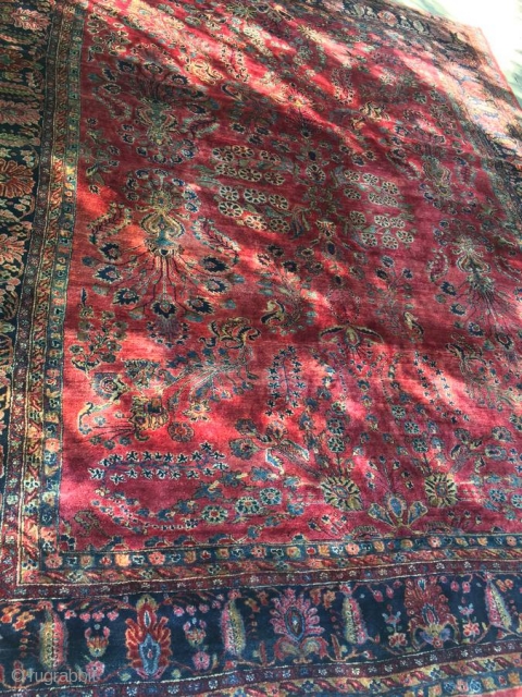 1920's Persian Sarouk measuring 10'8"x 13'3" in great condition, full pile, one end requires overcasting, some binding is starting to curl.  Thanks!          