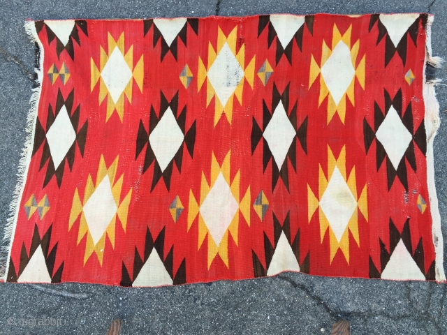 As found: Turn of the century transitional Navajo rug measuring 4'4"x 6'6" in need of service.  Ends need to be partially rewoven as well as some scattered area's in the field.  ...