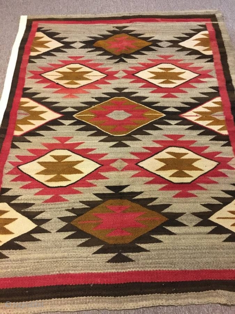 Nice older 1920's  Navajo with an 'A' side and a 'B' side measuring 56"x 71" ( couple inches wider from one end to the next), few stains, otherwise in good condition. 
