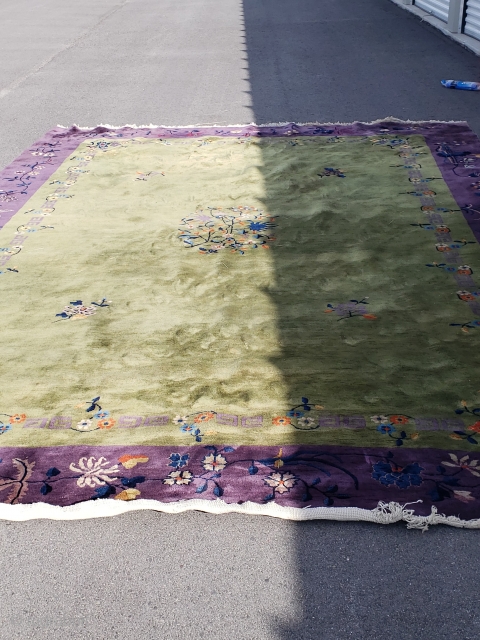 9’9”x 14’4” Old Chinese rug with a small area of moth grazing, small light tan stain, has recently been cleaned.             