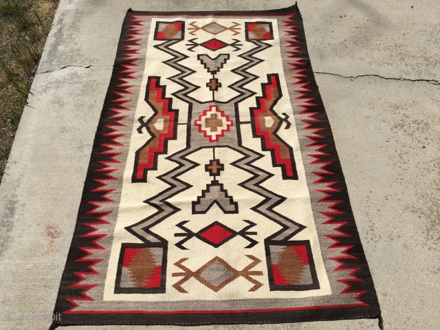 Aside from the little bit of the red color fading on one side, this 1930's JB Moore Storm Pattern Crystal Vintage Navajo Rug measuring 3'7"X 6'2" is good to go.  Woven  ...