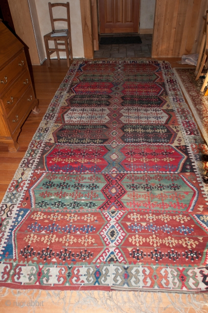 Pretty vintage Turkish Kilim that needs service, measuring 144"X 66".  Rug has a tennis ball size hole and a few other things that will need to be corrected.  Thanks.  