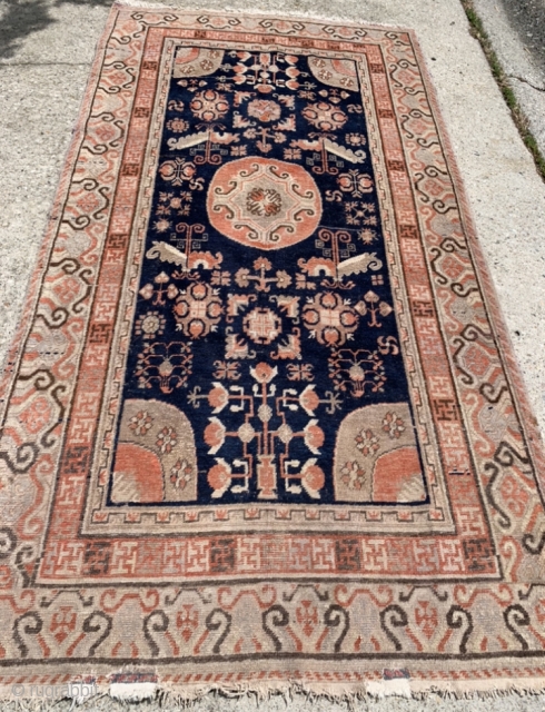 4’4”x 8’1” old Khotan with two small old and not so good reweaving jobs at one end. Otherwise, nice one for the price.          