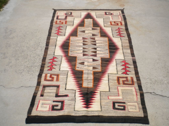 Rug Curator's find as found: A 1930's to 1940's Navajo measuring 45"x 84" in very good condition.  Thanks for looking.            