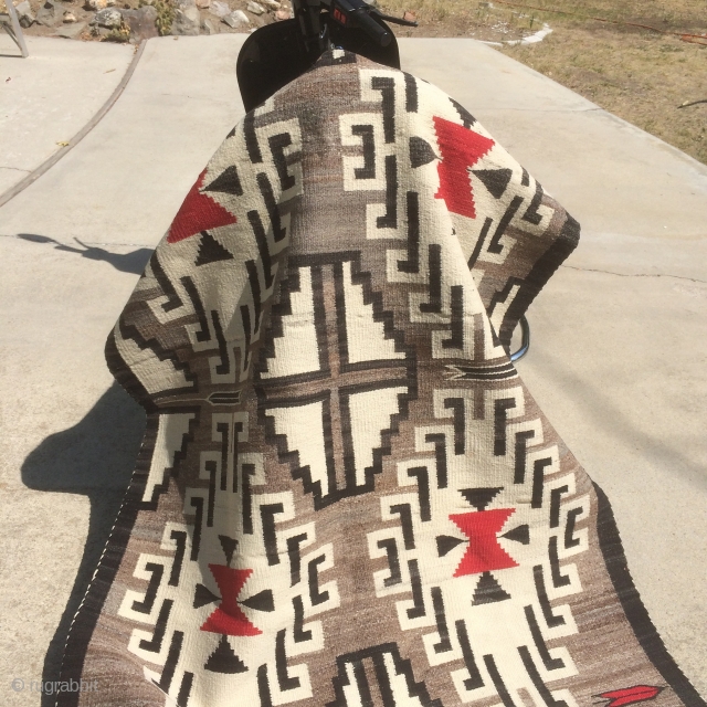 As found: Mid 20th century (1940's -1950's) vintage Navajo rug measuring 4'11"x 3'5" in mint condition.  Has 7 warps and 12-14 wefts per square inch.  Wool is Churro and natural  ...