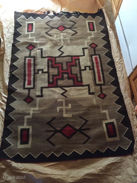 1920's-30's Navajo rug measuring 3'x 5' with a foots worth of reweaving that needs to be done on one end (maybe 2-4 rows of black border color), has a little notch on  ...