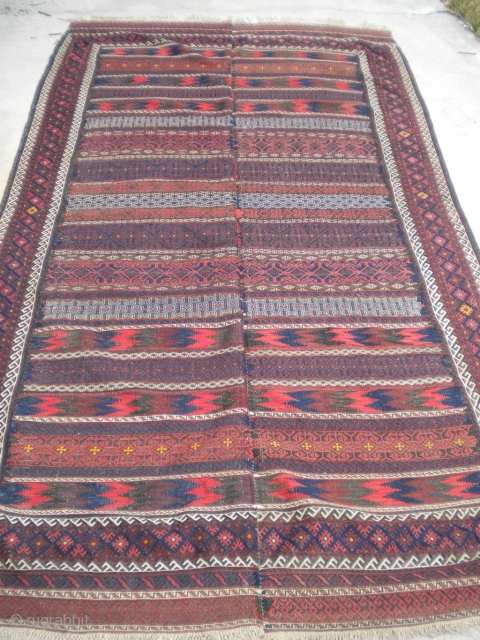 Here is a beautiful turn of the century Baluchi flatwoven rug with multiple styles of weaving, a great specimen, finely woven, size is 5'x8'11", in great condition.  Thanks!    