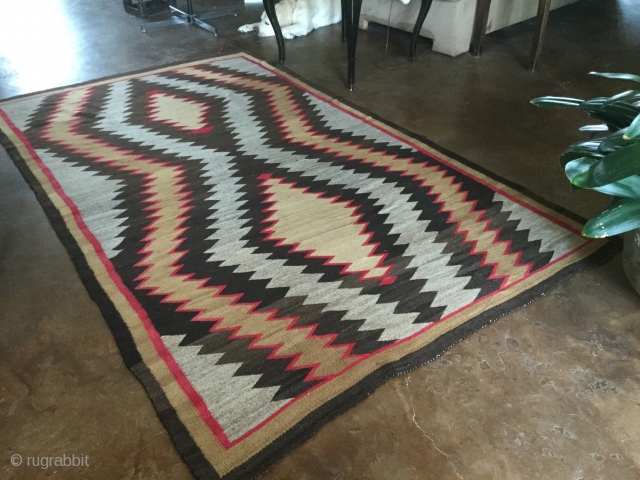 For sale is a very handsome Old Navajo rug measuring 5'7"X 9'4" in great condition.  Thanks for looking.              