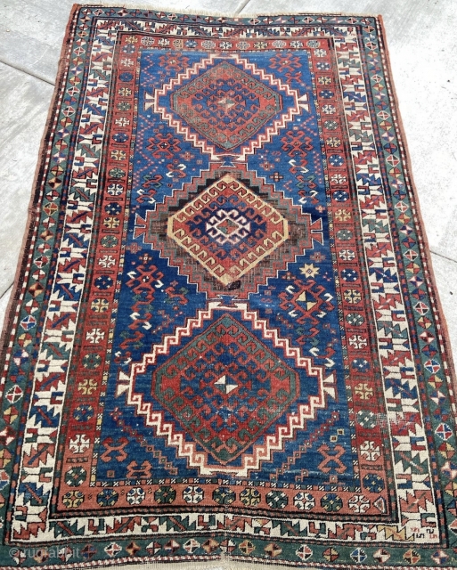 4’7”x 7’4” 1900’s Armenian Kazak with some foundation showing around center medallion where the brown has oxidized. Has a few other areas of scattered wear and a little loss at one end.  ...