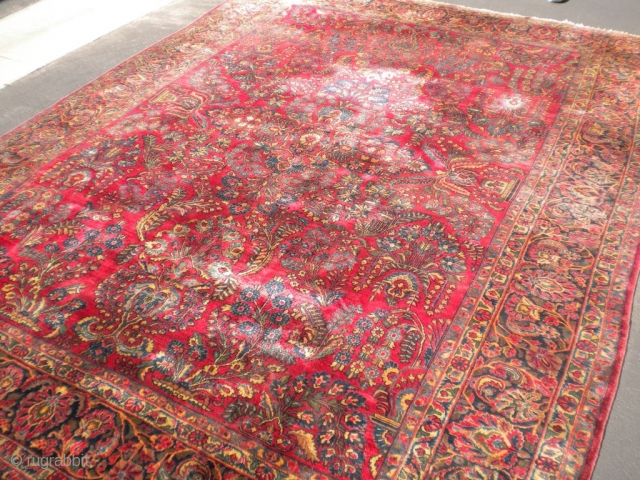 Fresh from an estate as found: A 1920's Persian sarouq, size is 11'10"x8'10".  It has good wool, good weave, good colors, but unfortunately, has wear almost down to the foundation in  ...