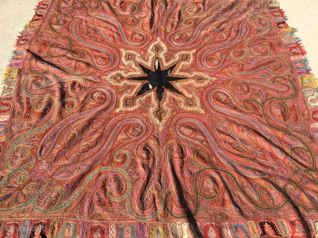 Late 1800's Kashmiri Shawl measuring 6'2"x 6'2" in great condition except for the black material in the center which has holes.            