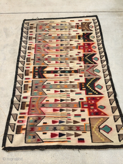 Rug Pickers find as found:  A 1920's Navajo rug measuring 5'10"x 3'8" that I can't pinpoint to a certain grouping or classification.  I want to say Yei, but that's probably  ...