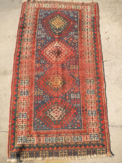 Rug-Pickers find as found: A late 1800's Caucasian rug still showing some enthusiasm despite it's beleaguered state.  The size is 5'9"x3', and just needs a lot of work.  The pictures  ...