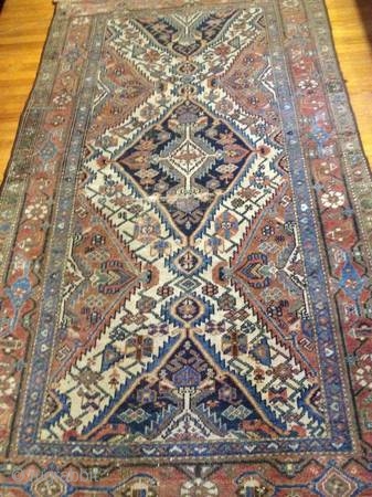 As found: A nice early 20th century Persian tribal rug with some minor wear measuring 4'x 6'.  Thanks for looking.            