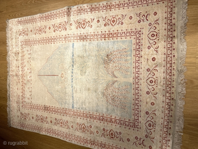 A TABRIZ SILK RUG.IN GOOD CONDITION AND PILE.                         