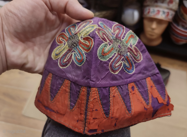 Antique Azerbaijan Silk on Silk Embroidered Childs Skullcap.

Some damages around it, l tried to show as much as possible on images.
Size: height 14.5cm and 41cm in circumference      