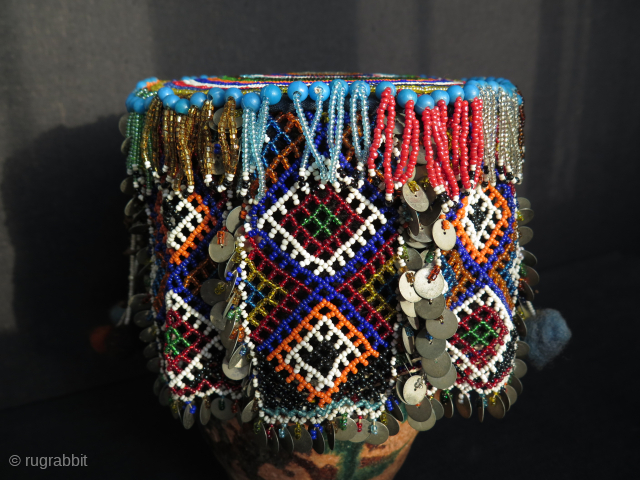 Turkish West Anatolian Bursa Traditional Woman's Beaded Hat. Used on ceremonial days.
In very good condition.

All glass beads except blue color large ones. Decorated with metal pieces.

Size: height 4.3" - 11cm and width  ...