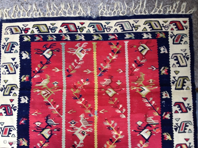 Early 20th C. Balkan kilim. Nice saturated natural colors. Some small repairs as
shown in photos. Size 52X75in./132X190cm. Washed. Buyer pays shipping.            