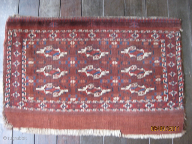 Antique Yomud Chuval, 3rd Qtr 19th C. As is with part of elem cut off. low even pile. Unusual "sharch palak" minor guls containing stars. Good natural colors. Size 44 X 29  ...