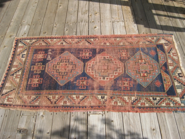 Bordjelou Kazak dated 1320 (1902) worn evenly but complete except one end missing about one inch. Original selvedges.Hand washed. 5'8" X 3'1"
           
