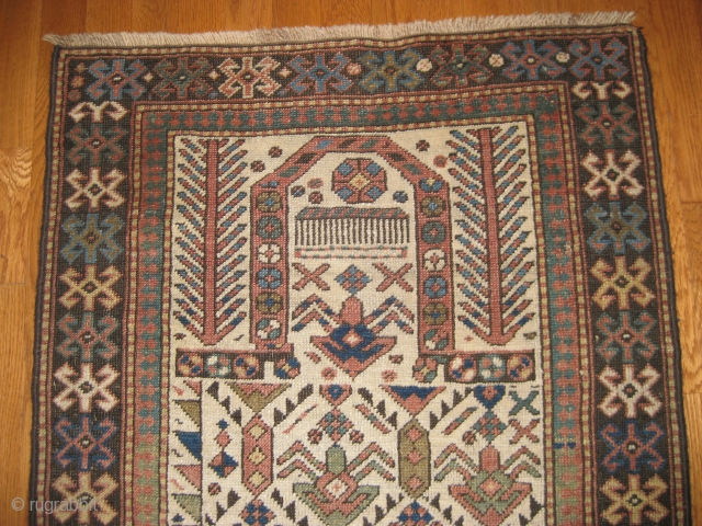Dagestan Prayer Rug, 3rd Qtr 19th C. Beautiful pastel shades and outstanding stylized flowers with an exceptional mirhab area. 5'7" X 2' 5". Missing outer guard borders on both sides but otherwise  ...