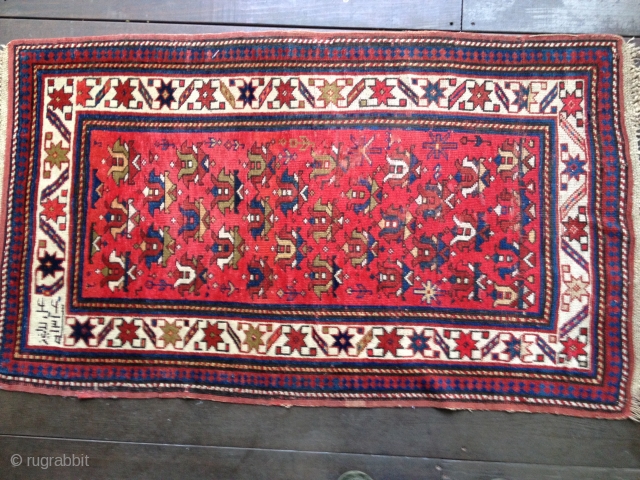 Antique Kuba rug, dated 1314/1896-7. All organic colors. Wonderful well-balanced palette with small tulips in an insect red field. Some limited areas of low pile and wear, otherwise good low to medium  ...