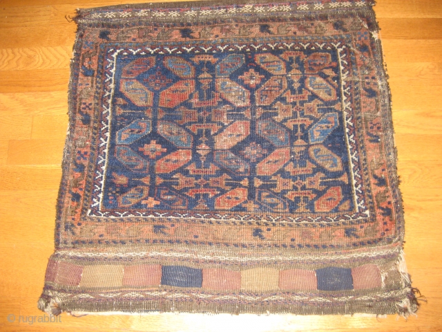 19th C. Belouch Bagface with good medium soft pile. Outstanding blues. Some oxidation of brown. Complete, striped kilim backing attached. Archaic design. Size 28 X 27 inches when closed. Retains a few  ...