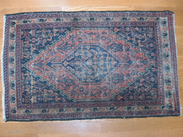 Antique Senna mat, ca 1910. All over even wear with some knots showing. Good colors. Sides and ends are complete. Size: 37" X 23"/94 X 58cm.       