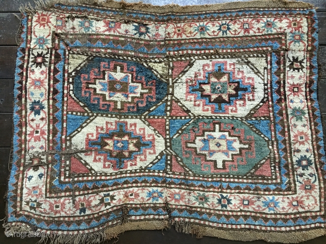 Antique Moghan Kazak Fragment. Cut and shut and both ends then sewn together and with a large patch and a 4"slit. Some good pile but overall rough condition.
Probably late 19thC and with  ...