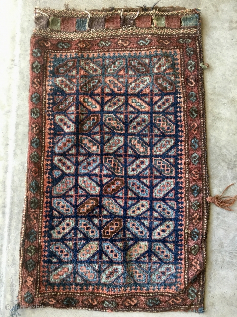 Antique Baluch grain or wall bag, late 19th century. Gorgeous natural colors including a stunning light blue. Complete original bag in full glossy pile with top closures and colorful kilim back. Measures  ...