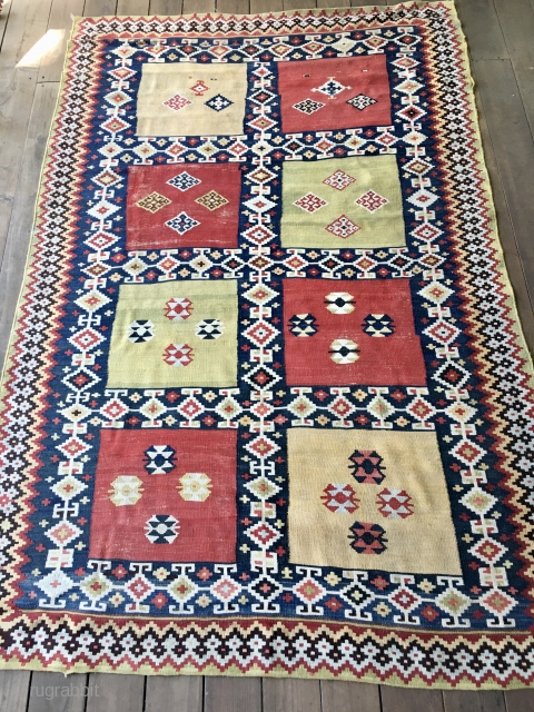 Striking Qashqui Kilim rug from the late 19thC. or early 20thC. All good saturated colors including aubergine. Size: 7ft. 9in. X 5ft. Good condition but with some worn areas as shown in  ...