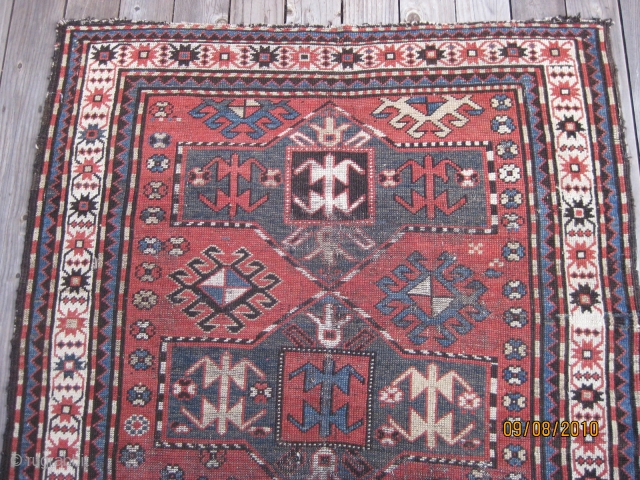 Late 19th C. Karabagh triple medallion rug. Unique geometric field design including rams horns. Low pile and some worn areas as shown, but complete with original selvedges. All natural dyes. Colors are  ...