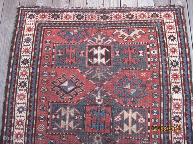 Late 19th C. Karabagh triple medallion rug. Unique geometric field design including rams horns. Low pile and some worn areas as shown, but complete with original selvedges. All natural dyes. Colors are  ...