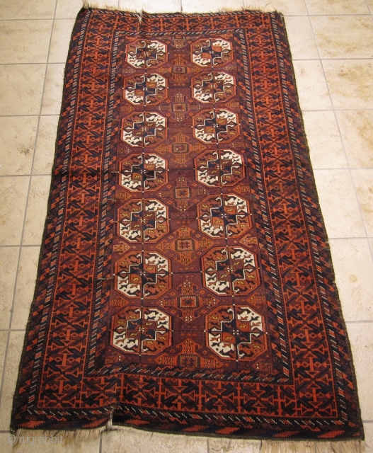 Antique Baluch rug with Tekke Guls. Size: ca 197cm x 102cm / 6'5''ft x 3'4''ft                  