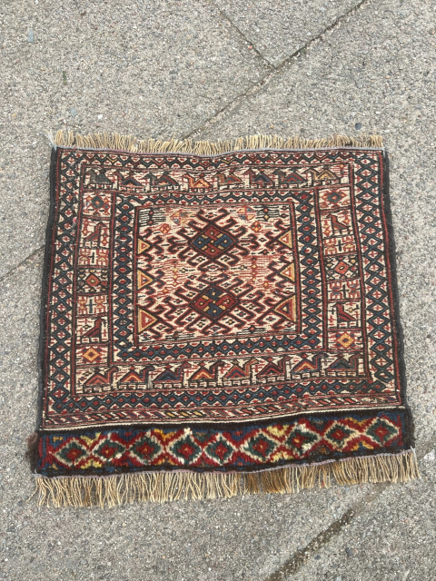 A very charming antique Luri Bakhtiary bagface. Lovely design displaying a camel caravan surrounding the center. Woven in Sumakh technique with a handknotted bottom. Size circa 45x40cm / 1’5ft by 1’3ft very  ...