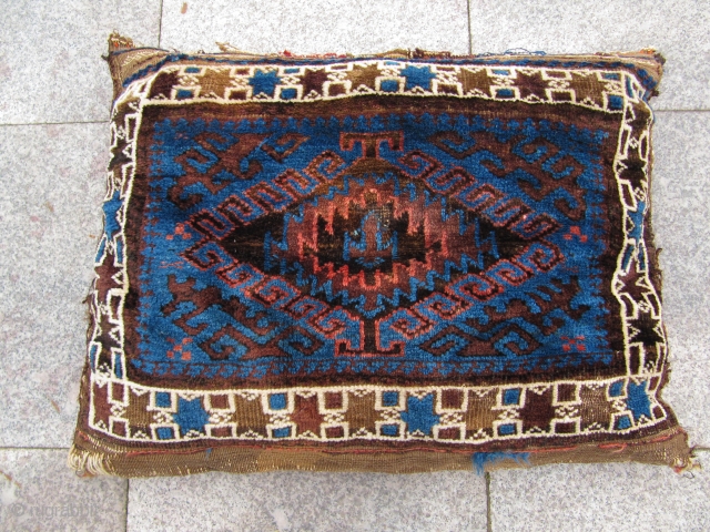 Lovely antique Baluch pillow with a white ground star border and a beautiful blue ground color . Size ( of the front ) : ca 65cm x 50xm ( 2'2''ft x 1'7''ft  ...