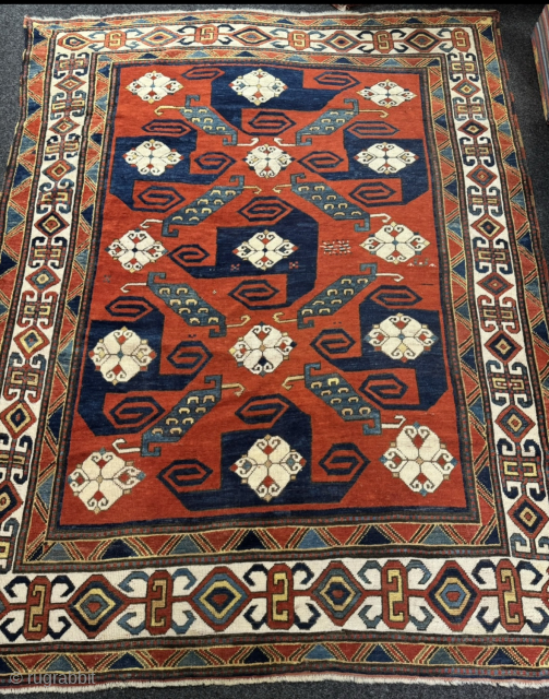 A Caucasian masterpiece: Impressive antique Pinwheel Kazak or so called Swastika Kazak from the mid-19th. Very well balanced geometric design and deep natural dyes. Good overall condition with original sides and ends.  ...